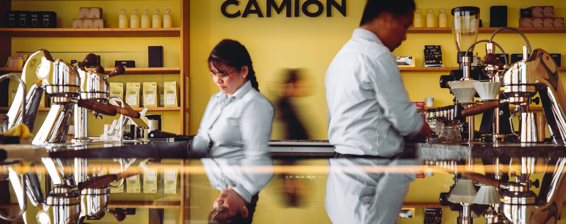Baristas working at Le Petit Camion specialty coffee café in Doha Qatar